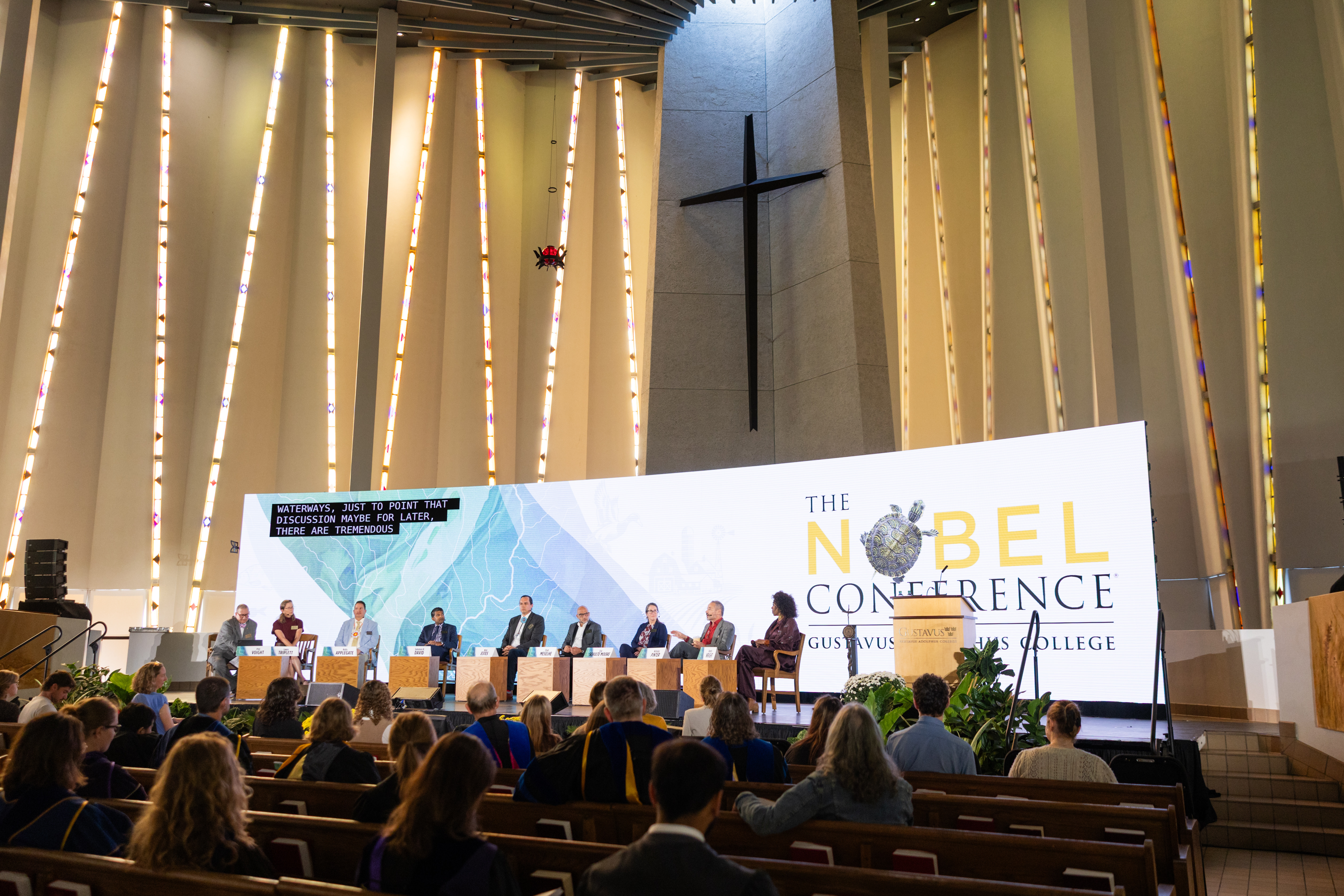 Nobel Conference panelists on stage in Christ Chapel