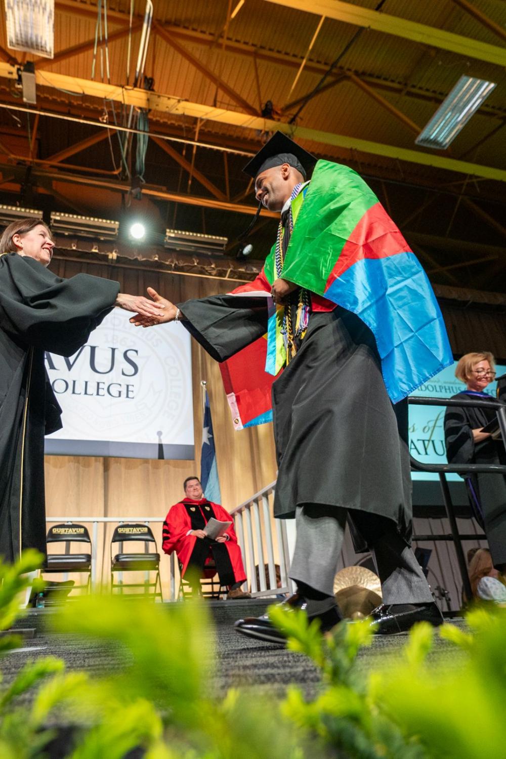 Graduate walking stage with flag