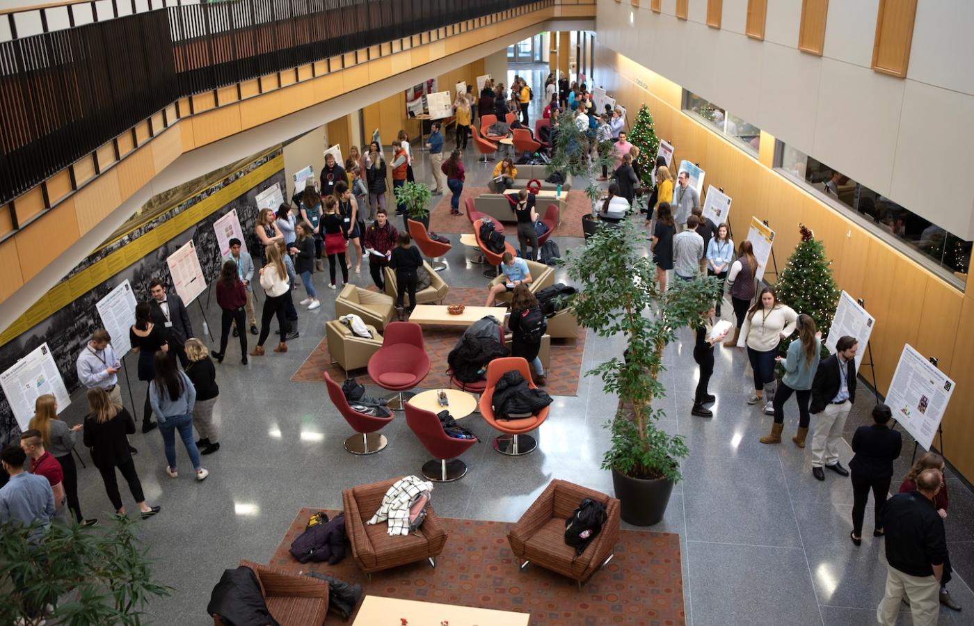 Students present their research in a beautiful building. 