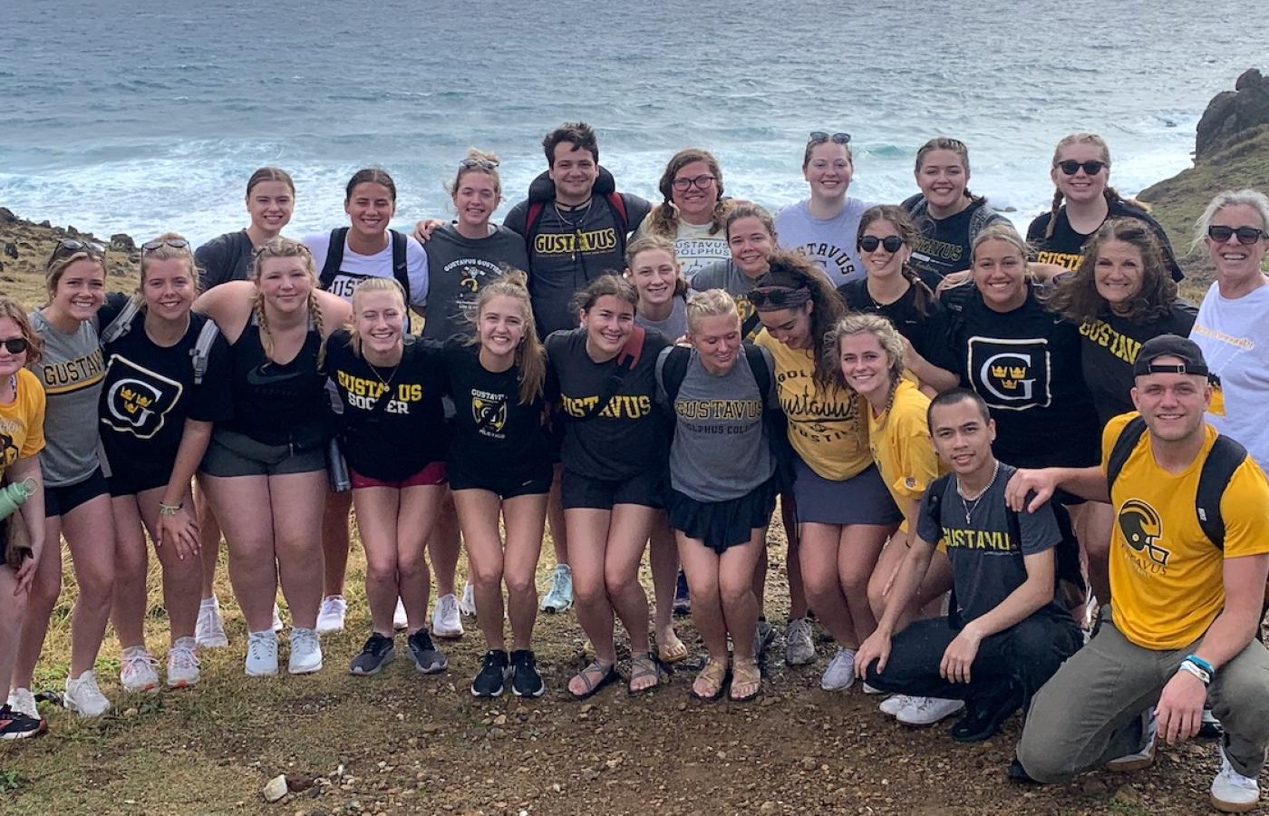 A group of education students in a coastal location.