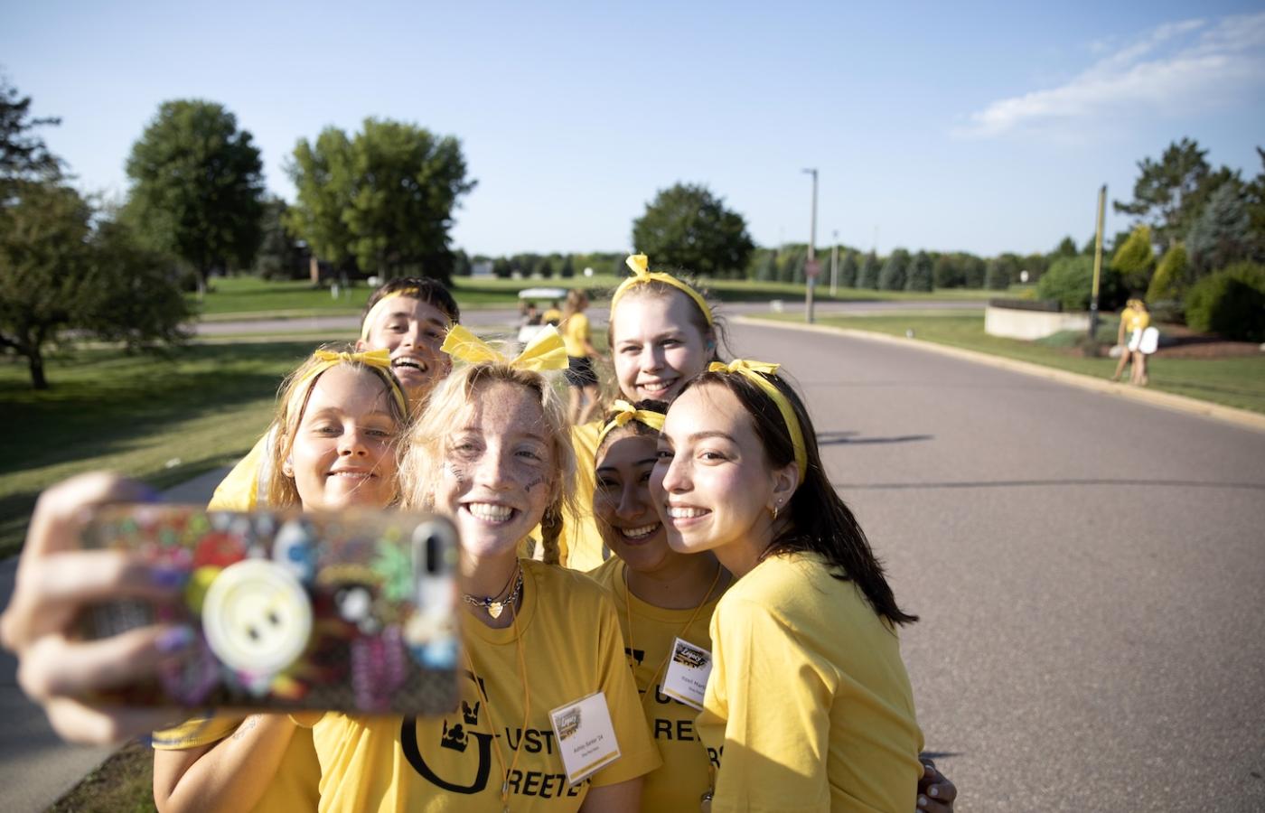 A group of excited students take a selfie