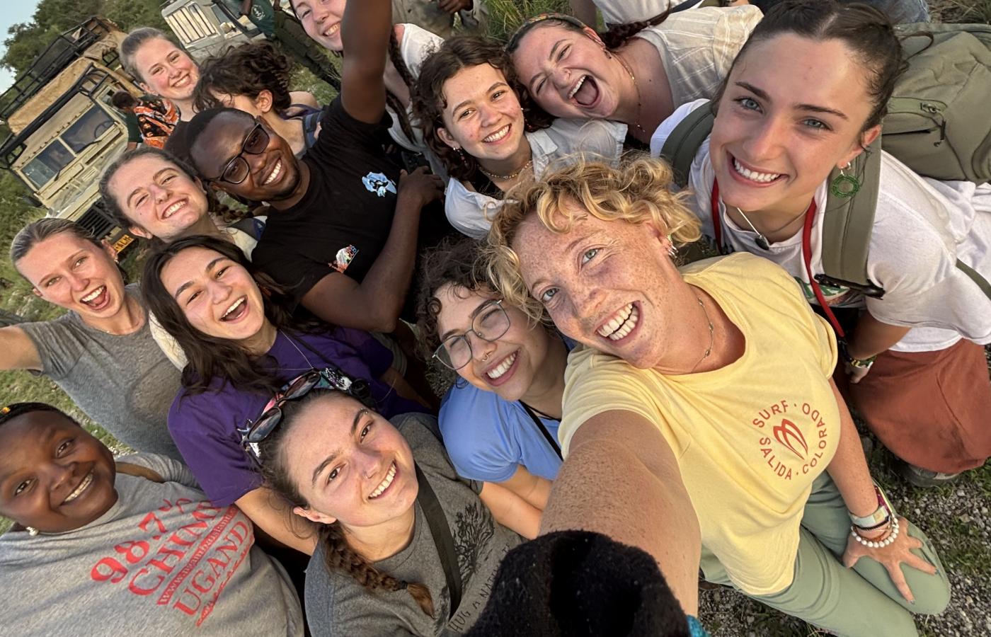 Students and people gathered for a selfie.