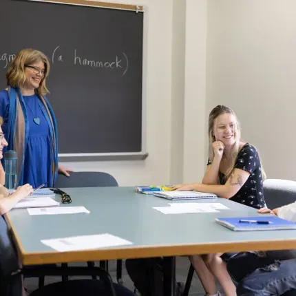 Scandinavian Studies professor chats with students in classroom setting