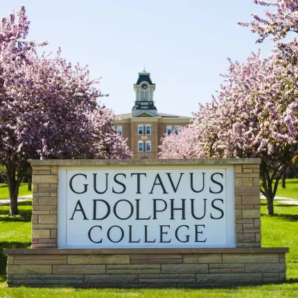 Gustavus sign with trees blooming