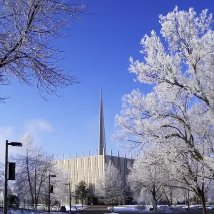 Christ Chapel during the winter with frosted trees and a blue sky