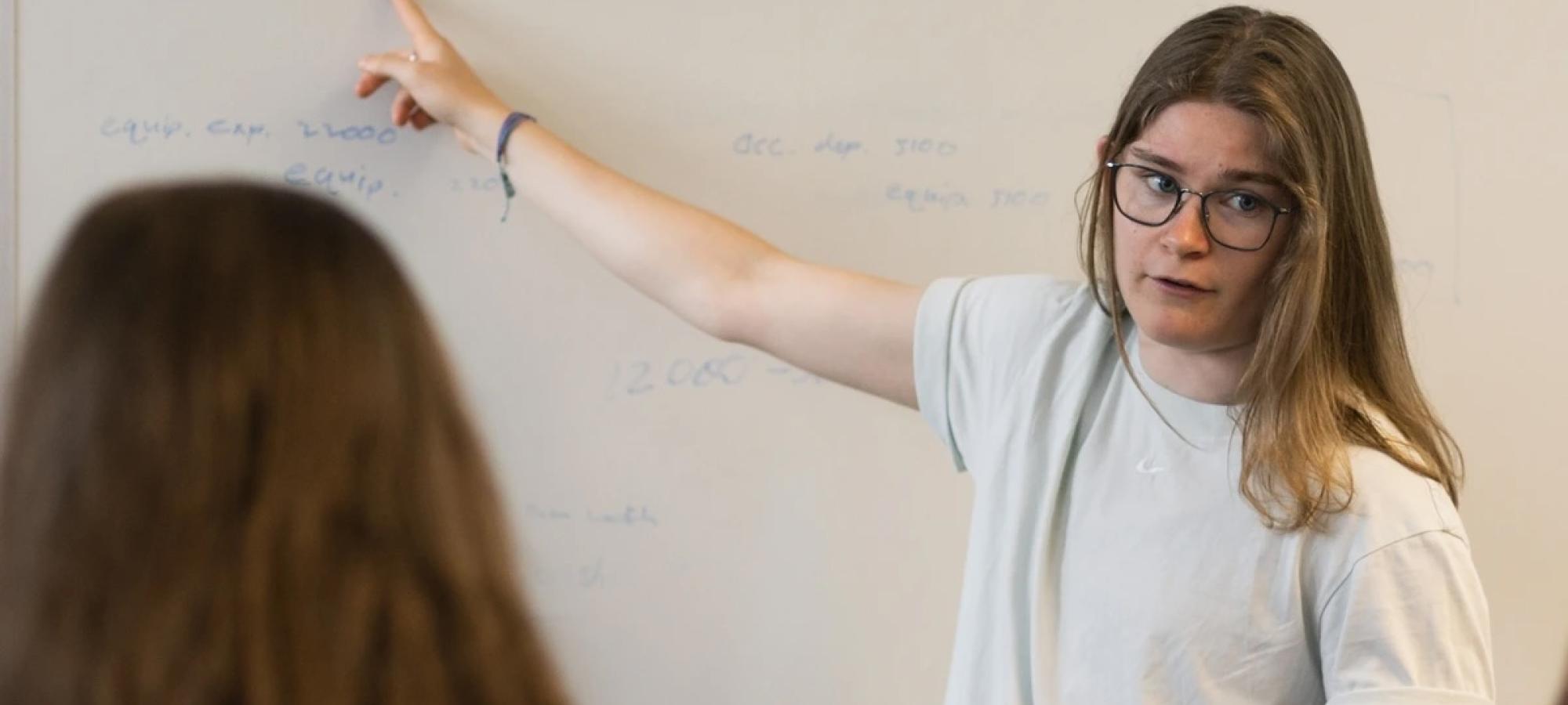 woman teaching economics