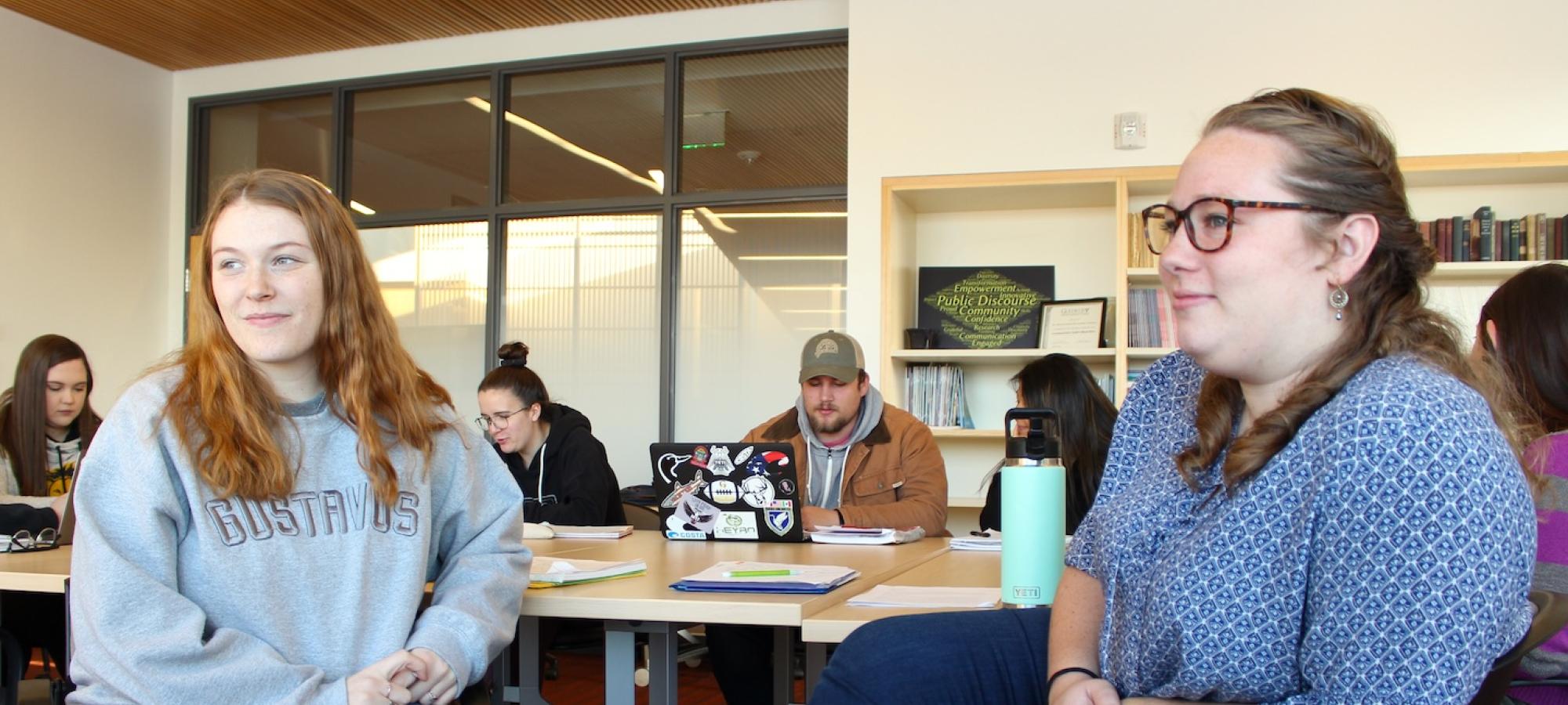 Students in class listening. 