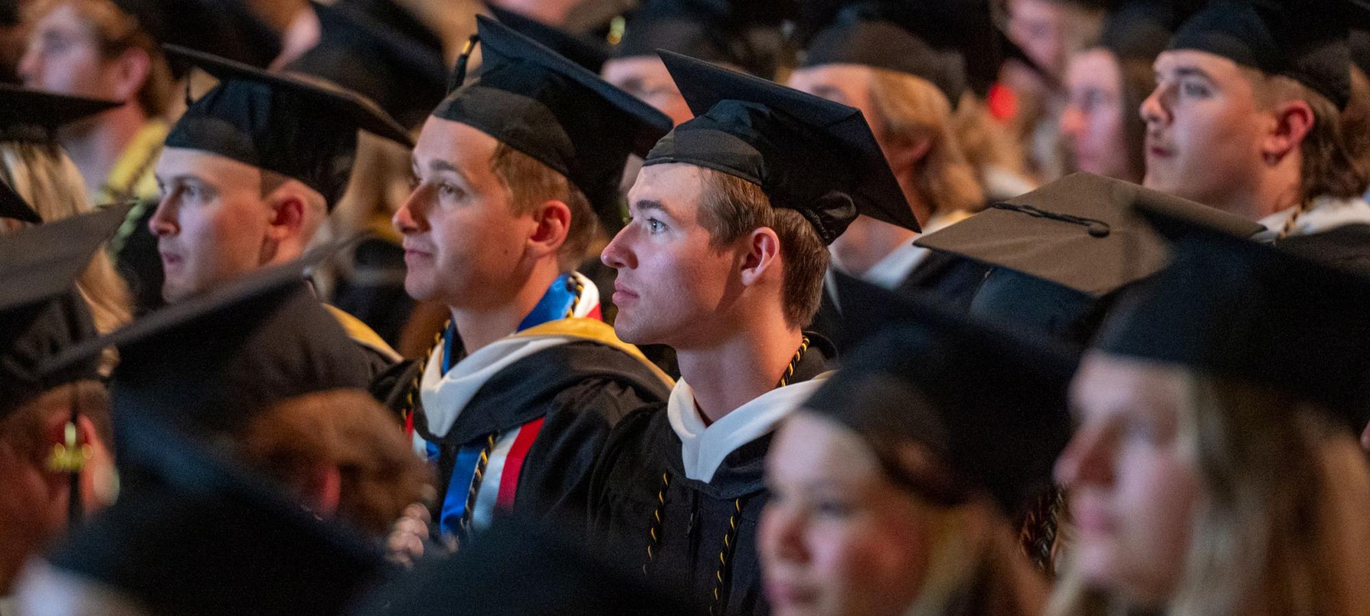 Grads watching Commencement ceremony