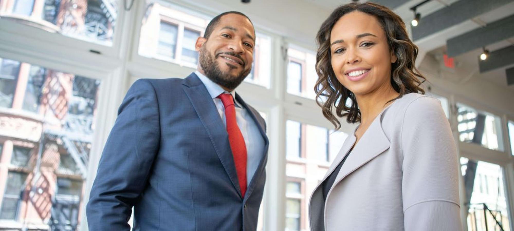 Young man and woman in business attire