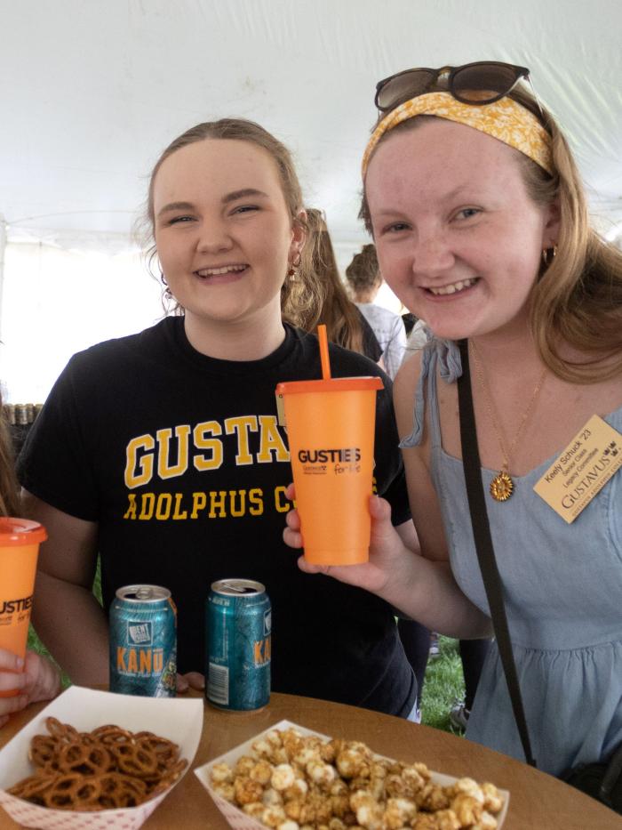 Homecoming tent with young alumni