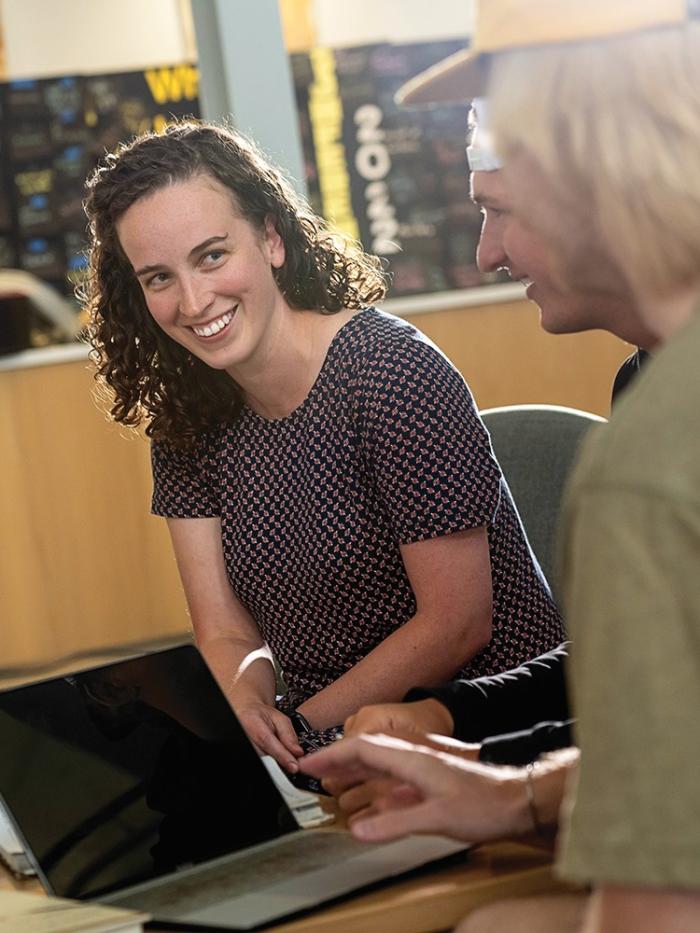 Faculty and students in Anderson hall atrium