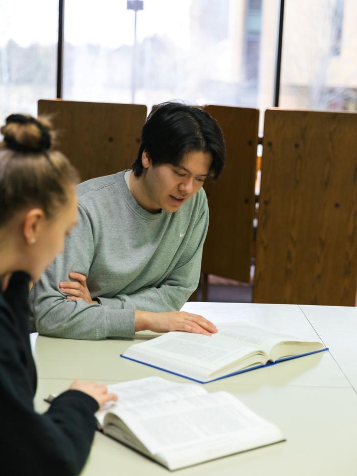 Students in Library studying at table