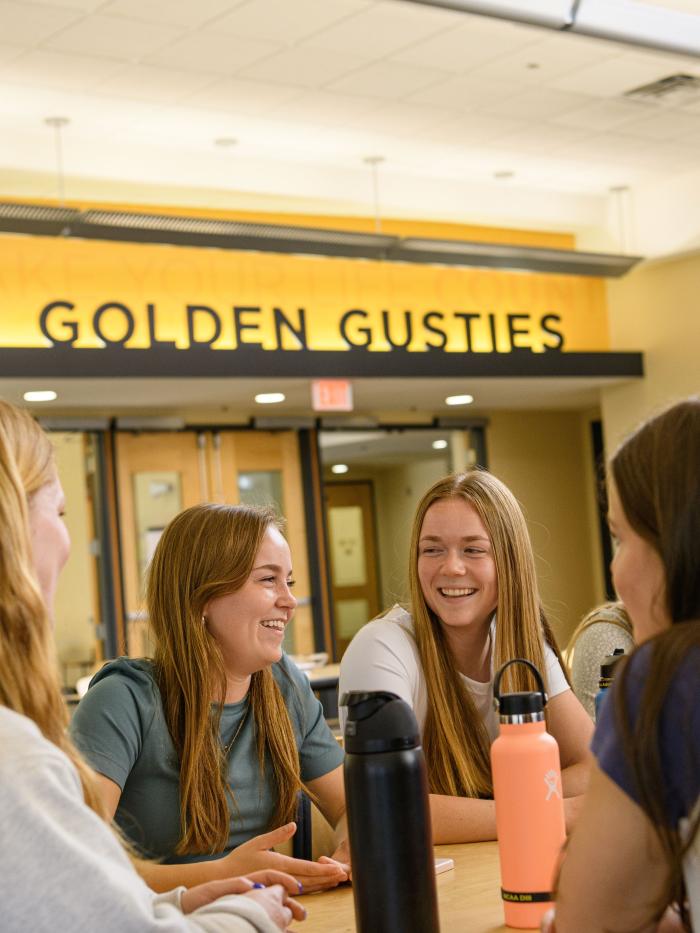 Students at table in dining room