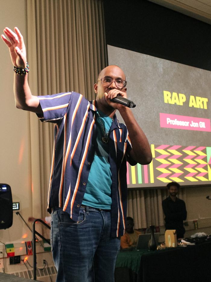 A Gustavus Adolphus College professor and rap artist at the mic. 