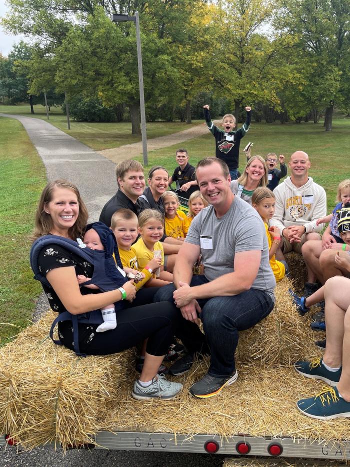 Alumni and kids at Homecoming hayride