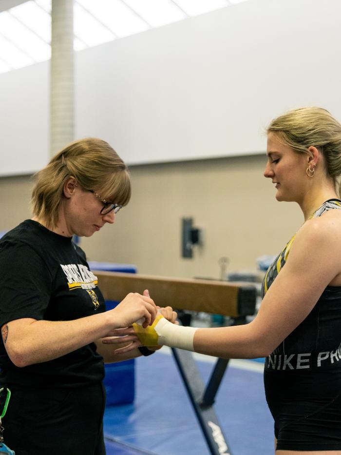 Athletic trainer with Gymnast
