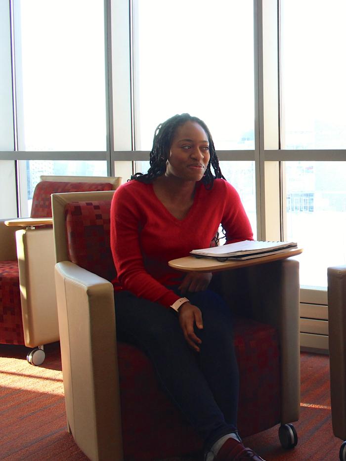 A college student listens intently in class. 