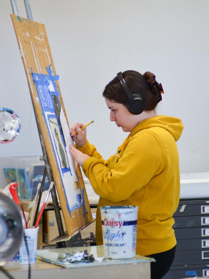 Painter in art building