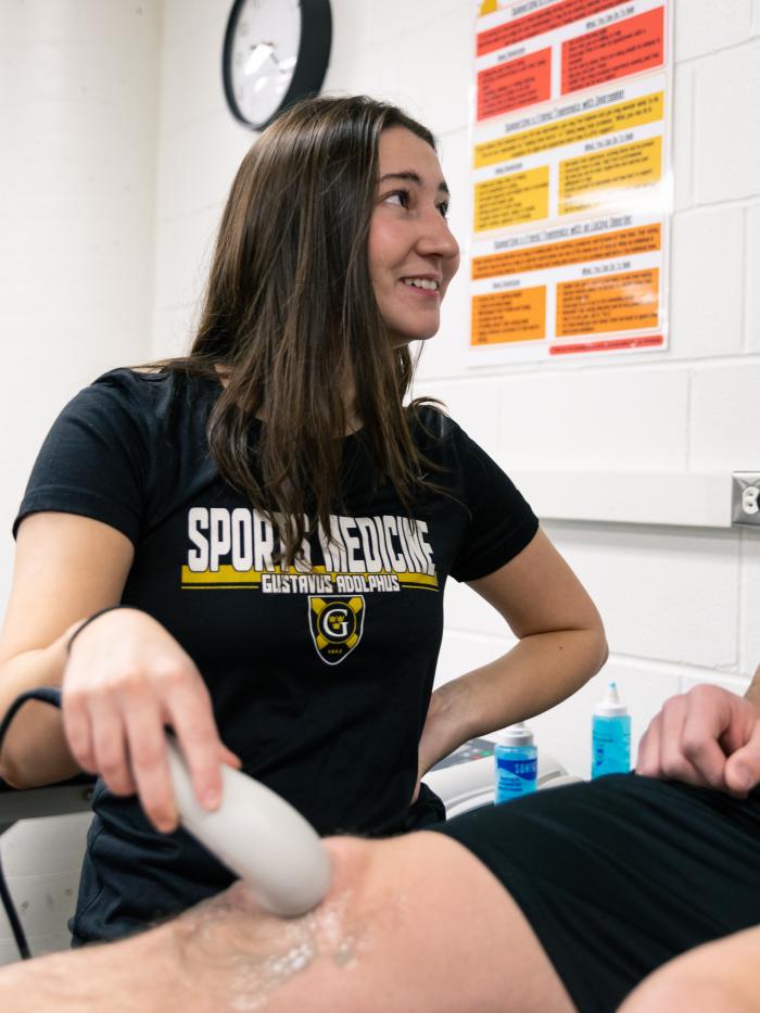 A student in sports medicine performs an ultrasound. 