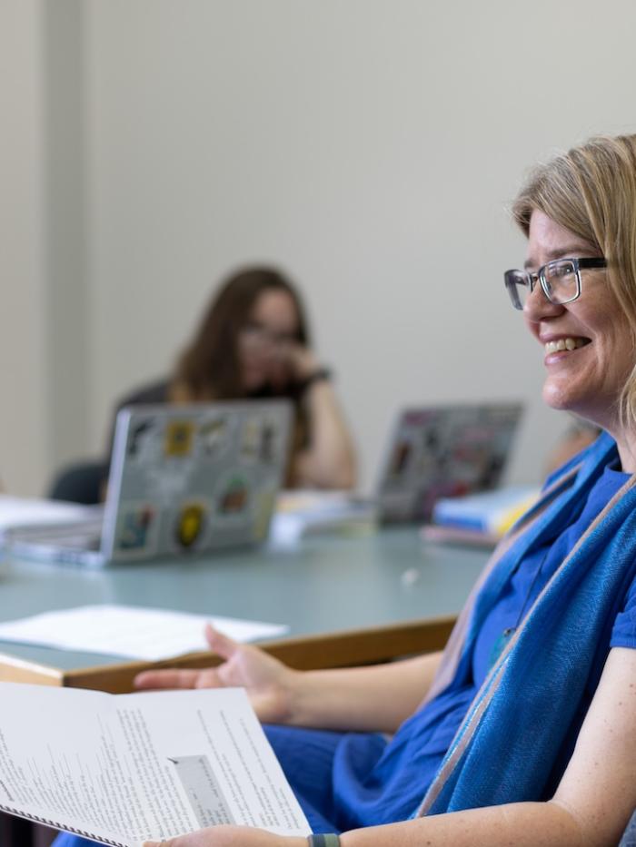 A Gustavus professor smiles at a student. 