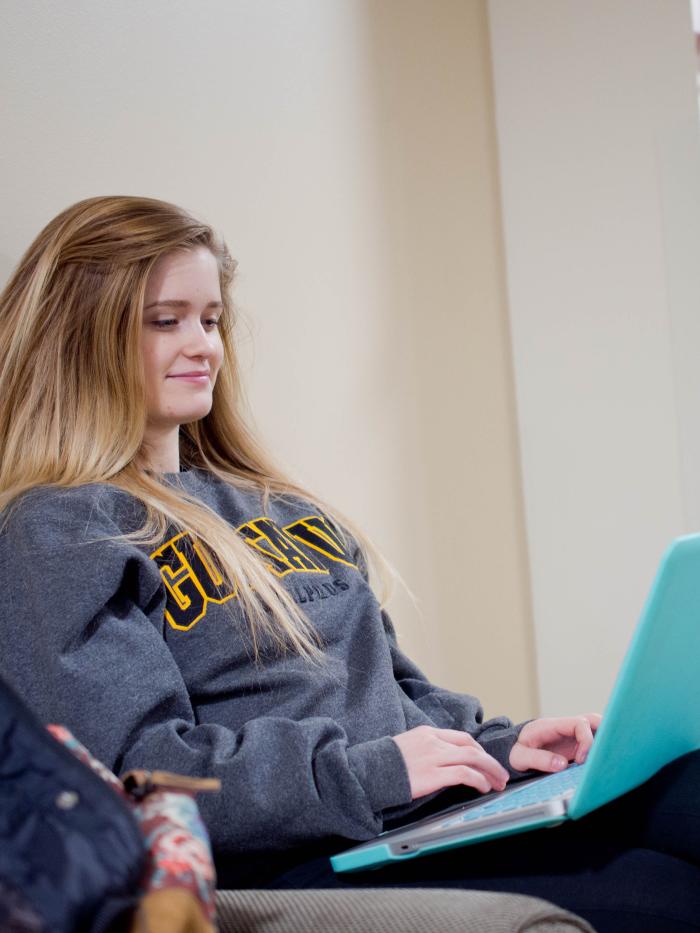 student studying on laptop