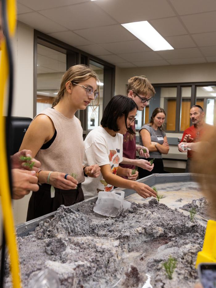 Gustavus students interact with stream tables