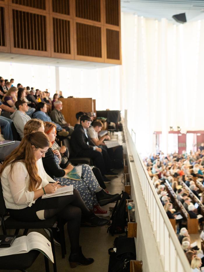 attendees in christ chapel viewing the conference speakers