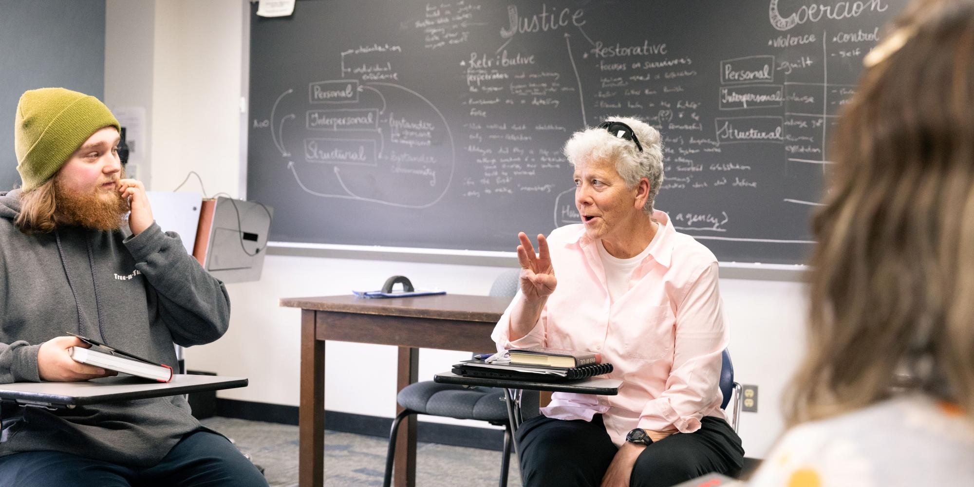 philosophy class with student and faculty